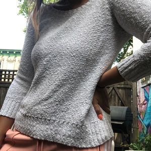 white sweater w/ zipper detail on back